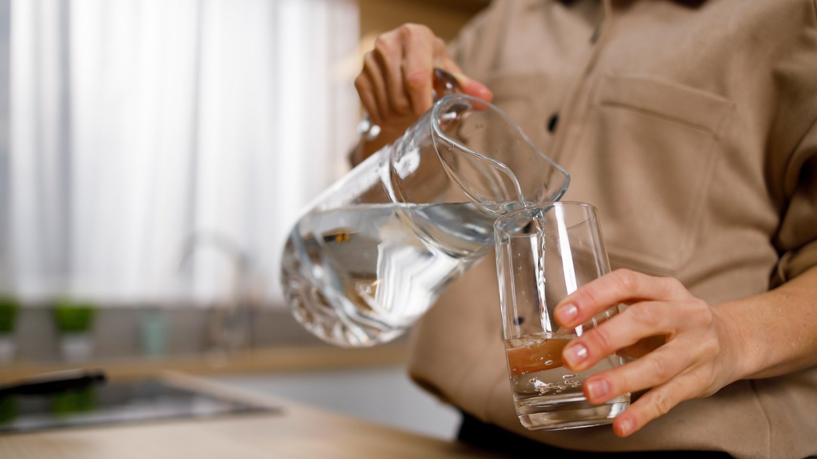woman-pouring-water-from-jug